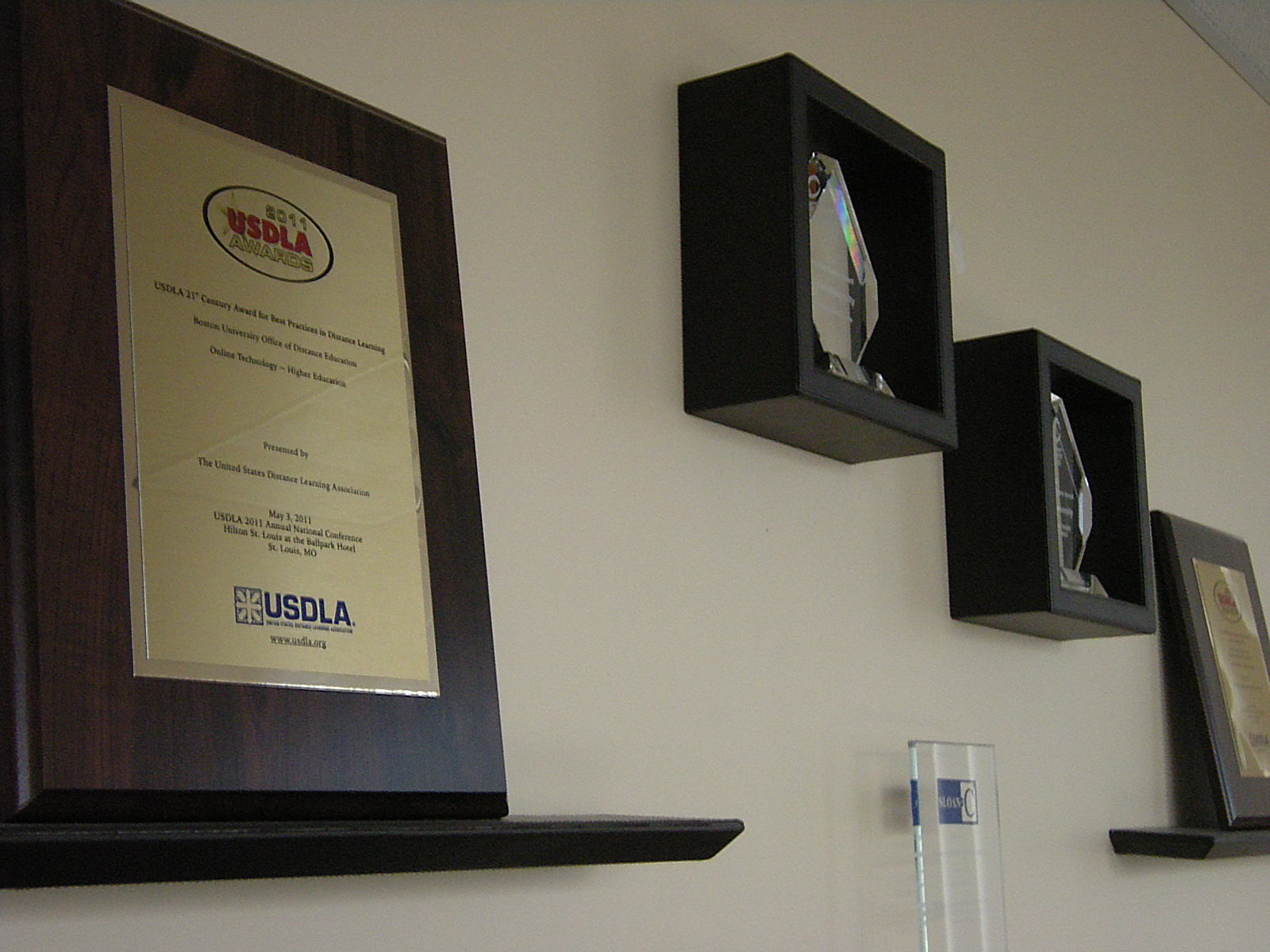 At left, the USDLA 21st Century Best Practices Award, the latest addition to our wall of honors.