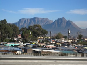 Table Mountain towers over the Flats.