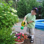 Ben watering Grandma's flowers, 2005