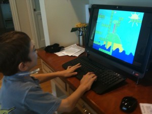Ben demonstrating how to play his game to Mom, July 2012