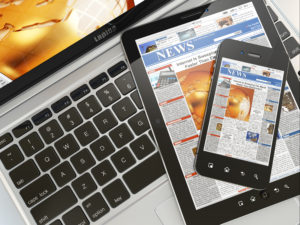 Digital news. Laptop, mobile phone and tablet pc to optimize SEO.