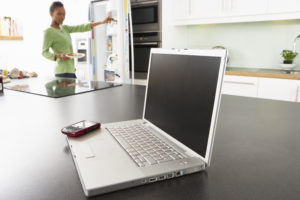 Laptop in the kitchen used for digital marketing.