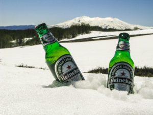 Two bottles of beer (alcohol) in the snow.