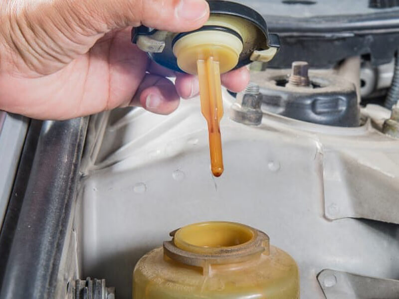 What does Milky hydraulic fluid mean
