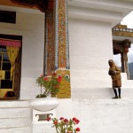 temple near paro.  this man -- listening to his radio as he walked -- likely circled the temple all day.