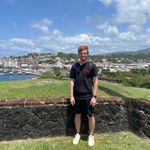 Kevin Hauger (Poetry '26) shows off his program-sponsored t-shirt in Martinique